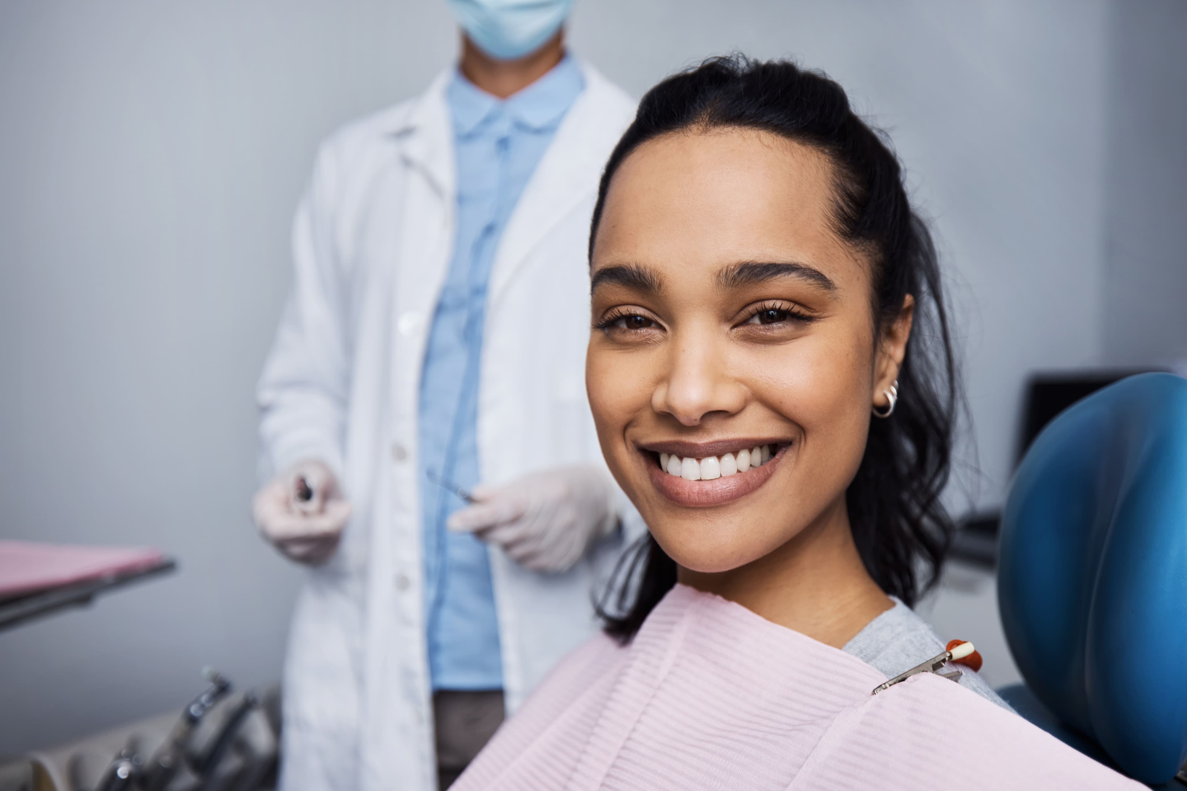 Smiling patient in a dental chair