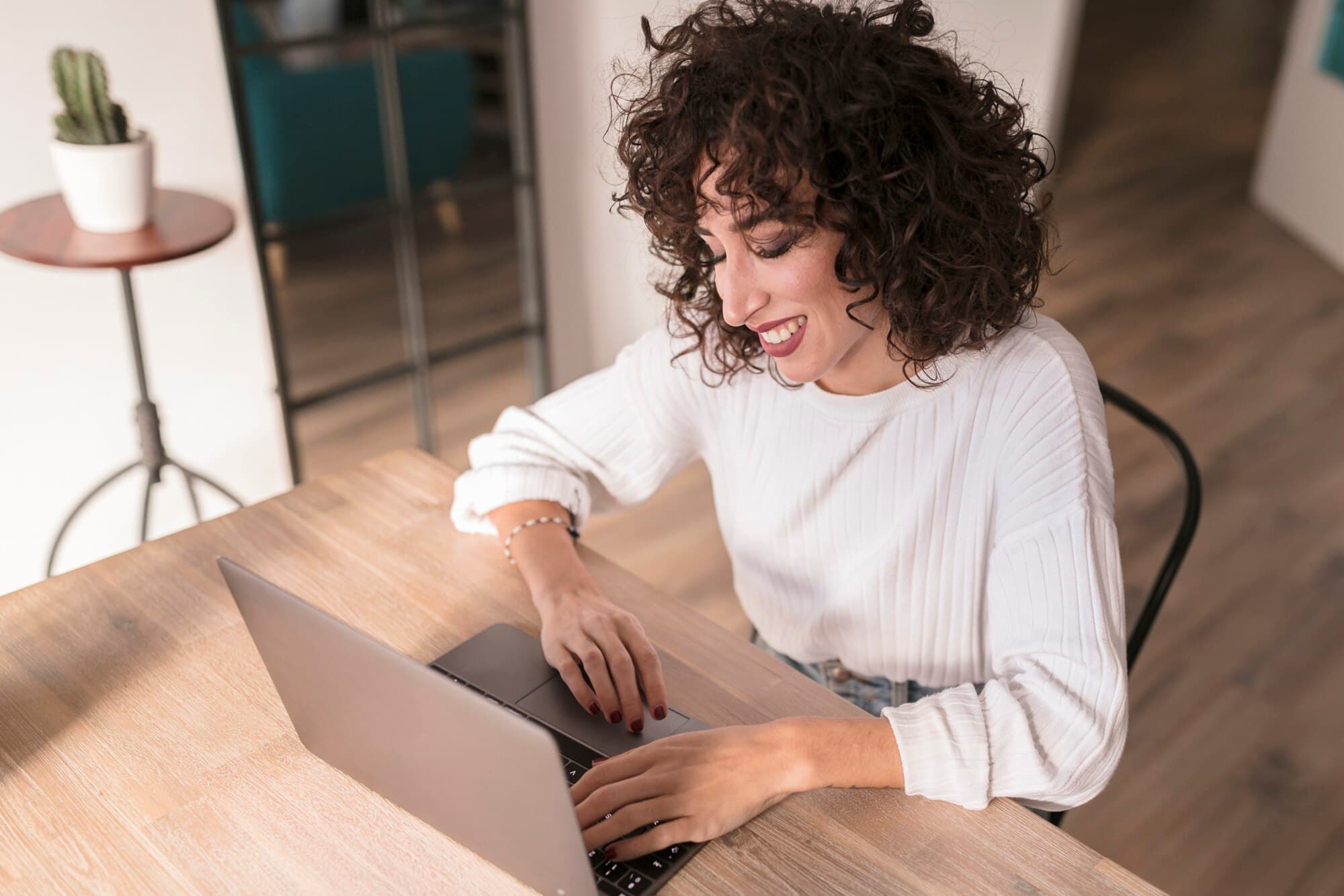 Woman working on a laptop at home